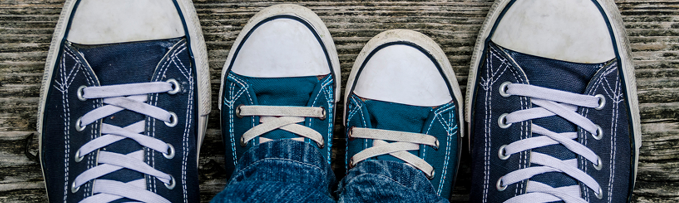 Aerial view of adult and child sneakers