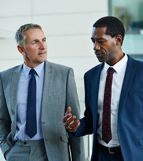 Two business men walking and talking