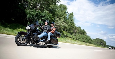 Motorcycle rider and passenger