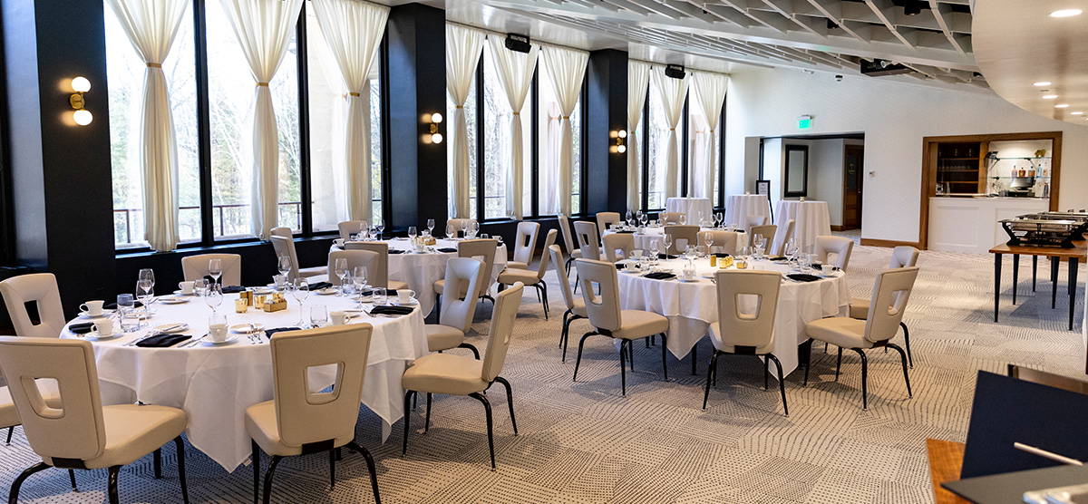 Dining tables arranged throughout the Gallery Room at Muse