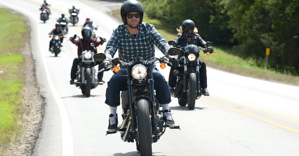 Group of motorcycle bikers riding together