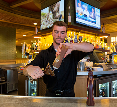 Bartender making a dessert cocktail at the PJ's bar