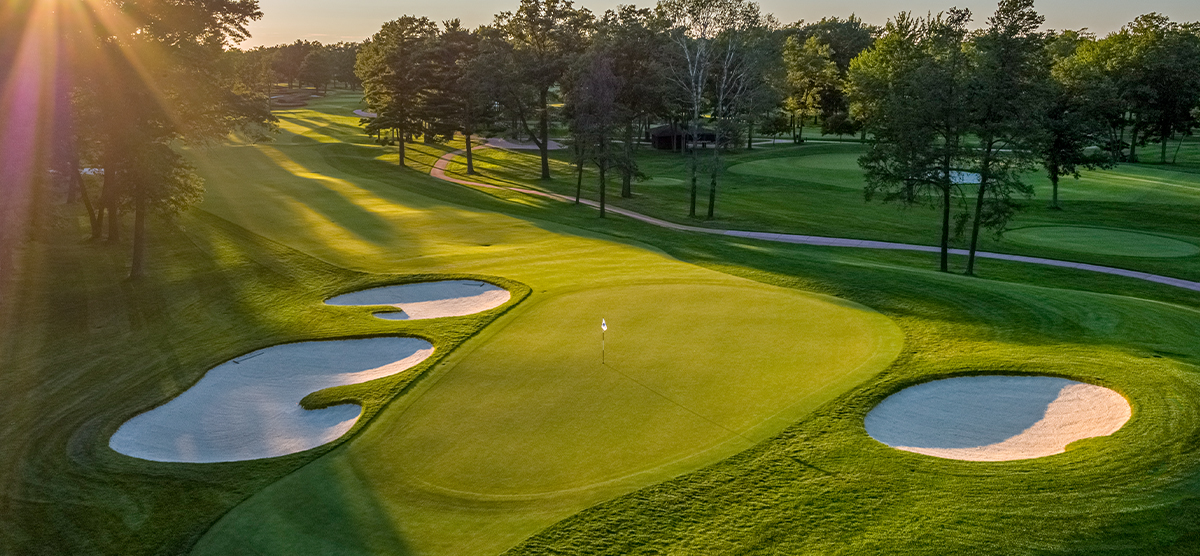 Aerial view of the putting green on the first hole at the SentryWorld golf course