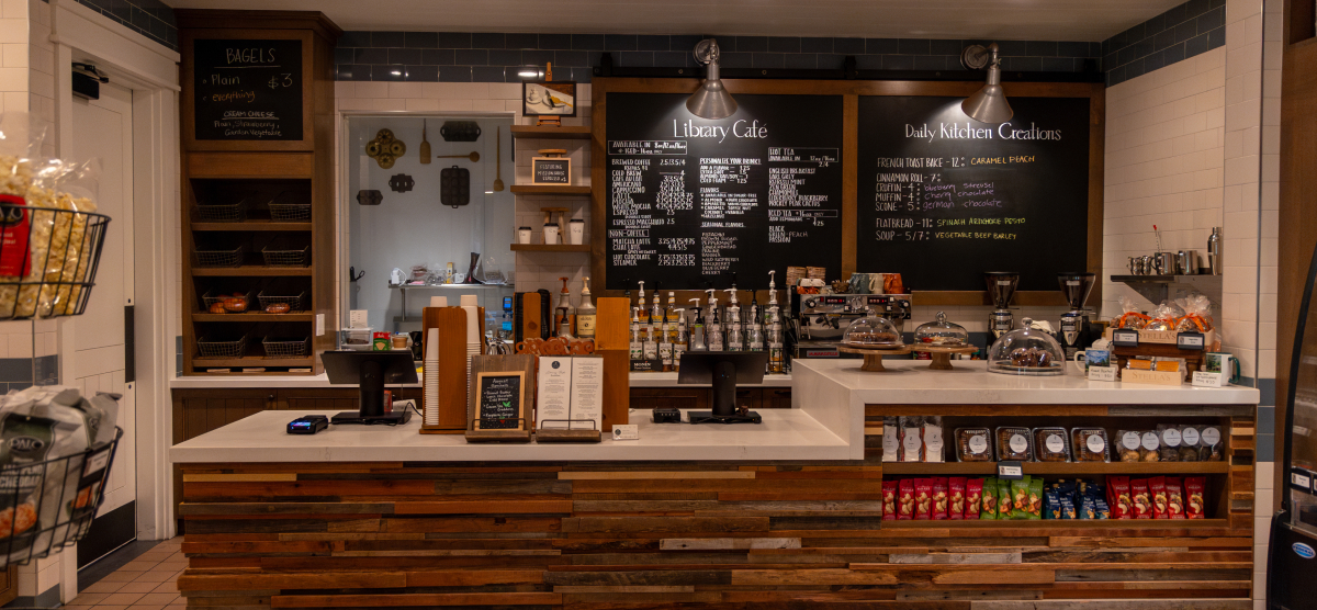 Library Cafe ordering counter with baked goods, snacks and coffee. 