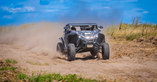 UTV driving through sand
