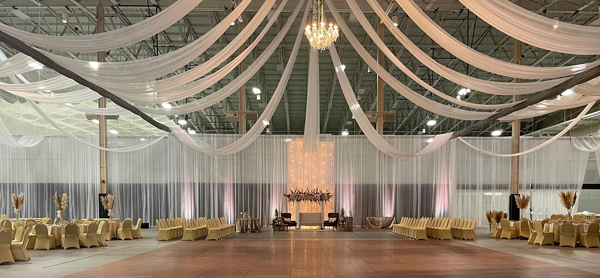 carousel-wedding-venue-fieldhouse-5-1200x556 Dance floor area with draping fabric from the ceiling of the fieldhouse.