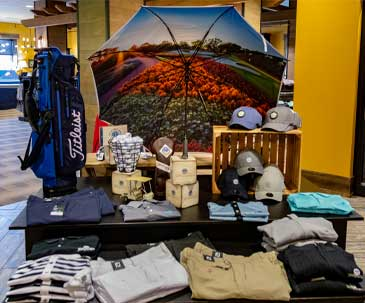 Table display of golf gear available for purchase at the SentryWorld Pro Shop