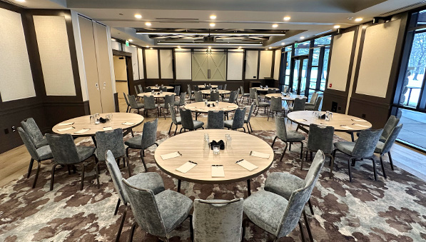 50-50-sales-offer-597x339 Inn meeting room set up with round tables.