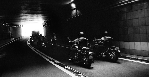 Group of motorcyclists in tunnel