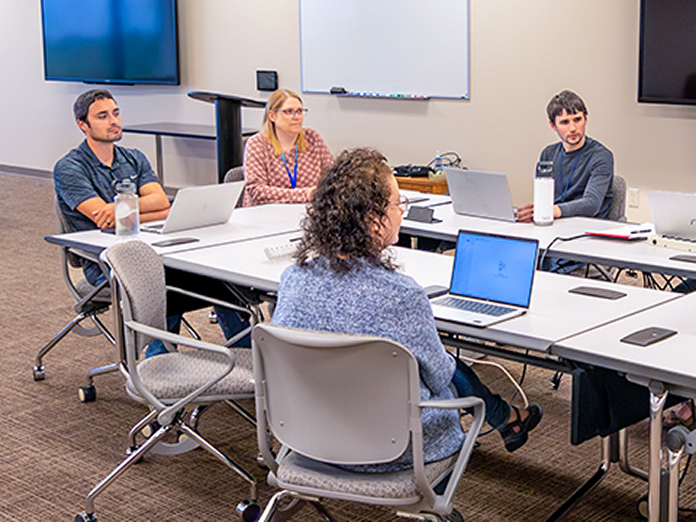 teams-actuary-SHO-696x522 Actuary associates in a meeting at Sentry home office in Stevens Point, Wisconsin.