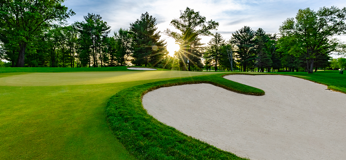 Sand trap next to the seventh hole putting green at SentryWorld