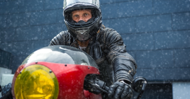 Motorcycle rider bundled up in winter