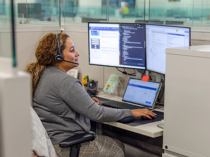 Woman speaking to a customer with a headset 