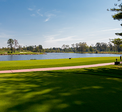 Cart path next to a body of water at the SentryWorld golf course