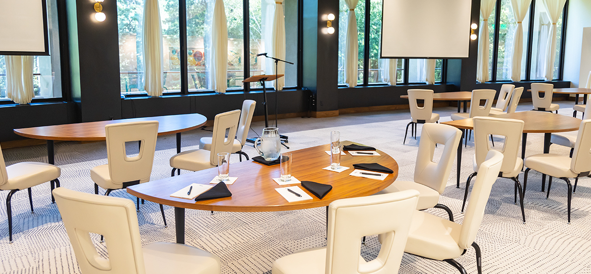 Tables set for a meeting in the Gallery Room at Muse