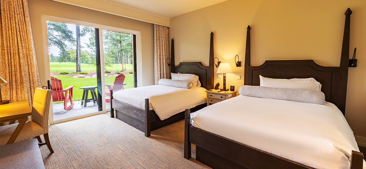 carousel-accessible-queen-terrace-1-1200x556 Two queen beds with seating area and a terrace overlooking the golf course.