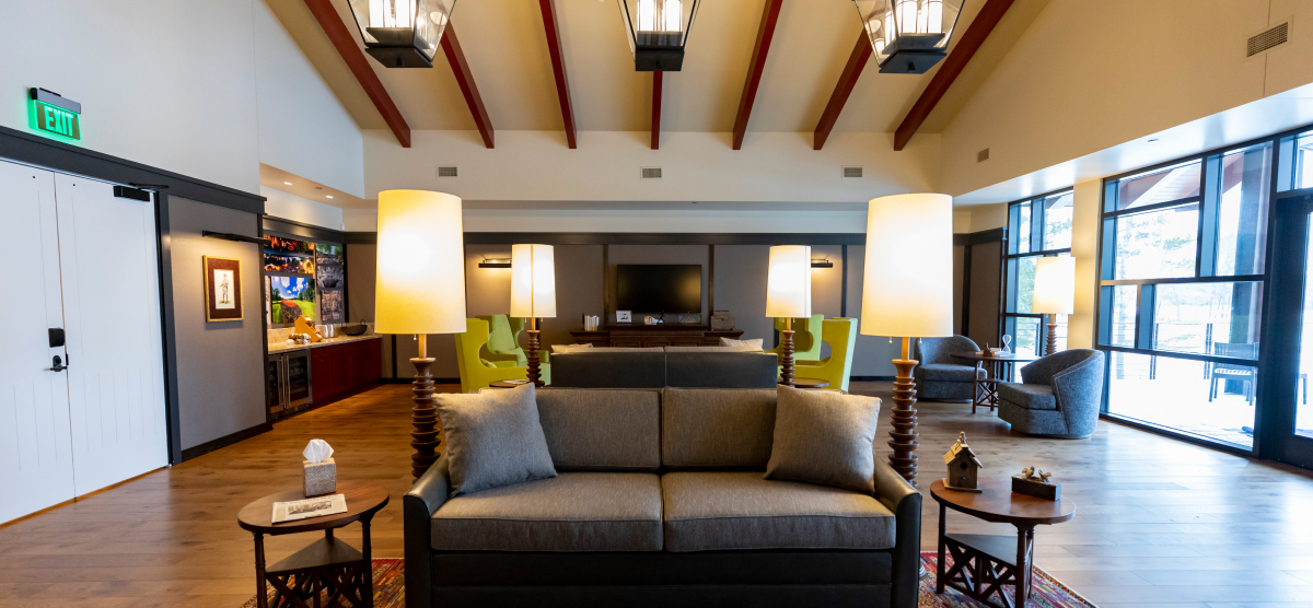 The Executive lounge with indoor seating and a balcony area with more seating. 
