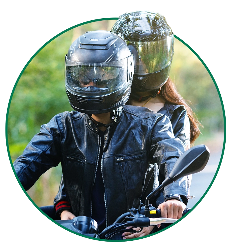 motorcycle-riders-circle-crop-LG a helmeted motorcyclist and passenger