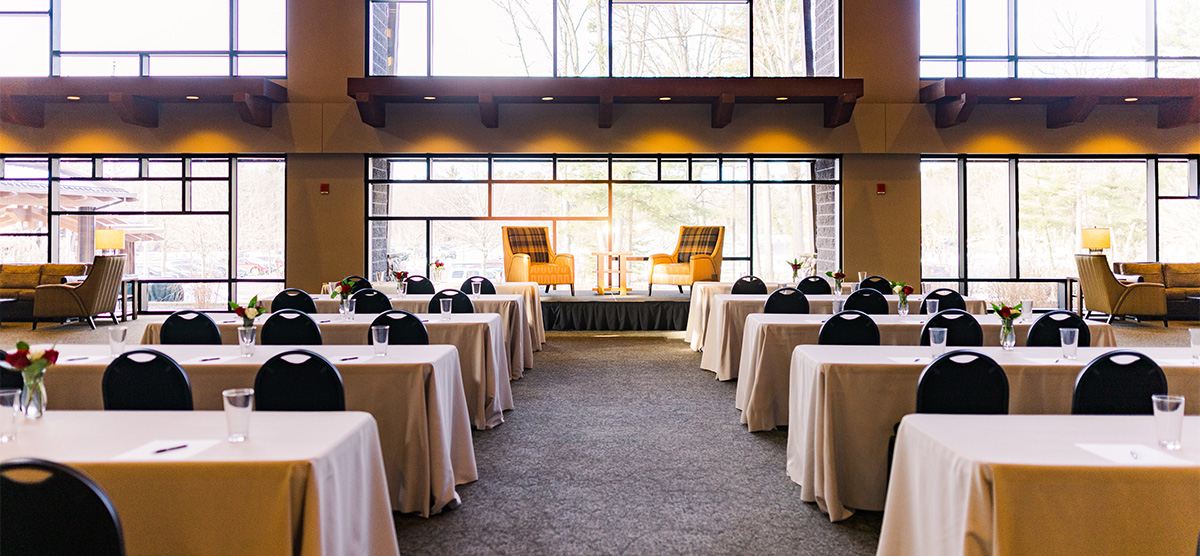 Event tables facing the wall of windows in the Atrium at SentryWorld