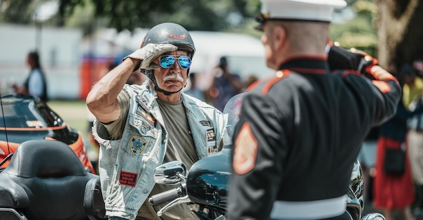 Biker and veteran salute each other