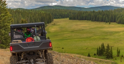 Family in ATV overlooking valley