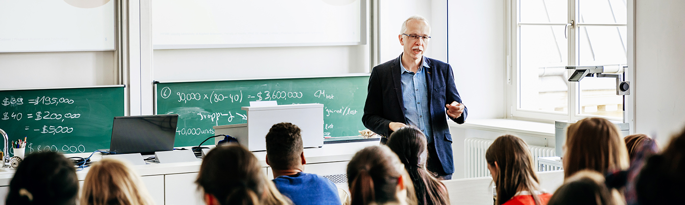 Teacher talking in front of a class