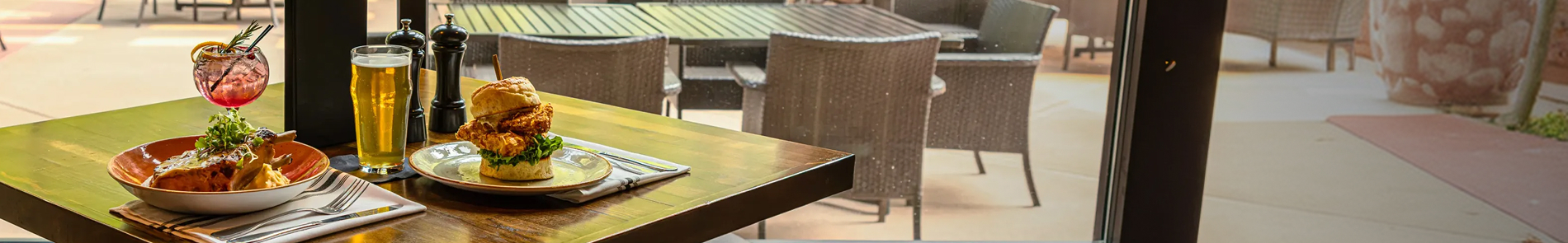 A table is set with two dishes and drinks at PJ's.