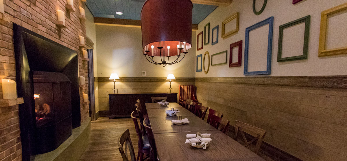 Dining table and fireplace in the Celebration Room at PJ's