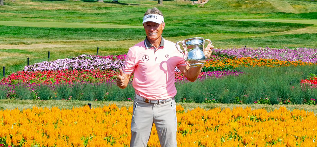 Bernhard Langer at hole 16 with the U.S. Senior Open championship trophy