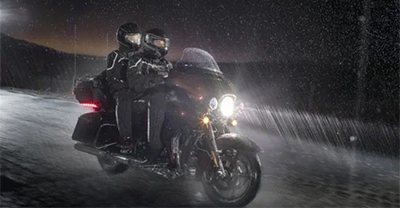 Riding motorcycle in rain at night