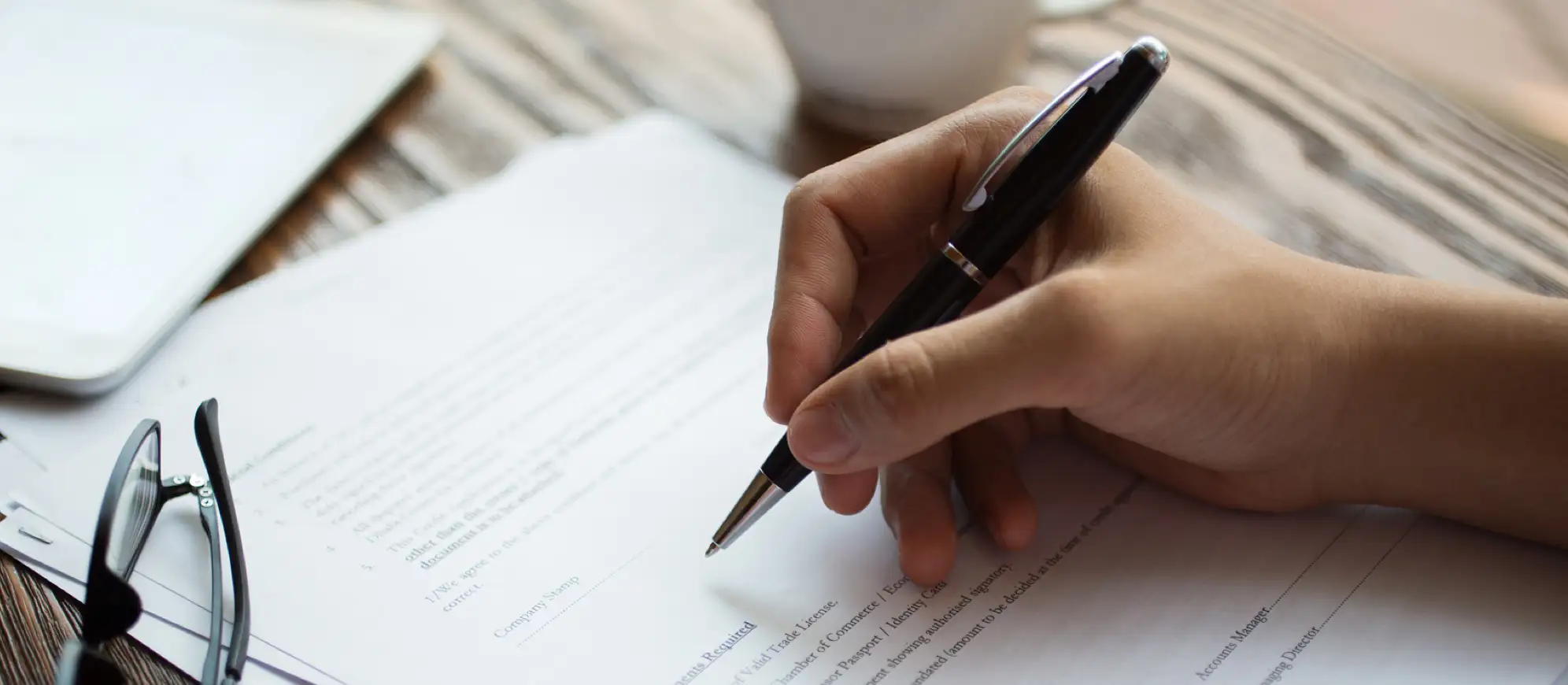 hand signing an SR22 form