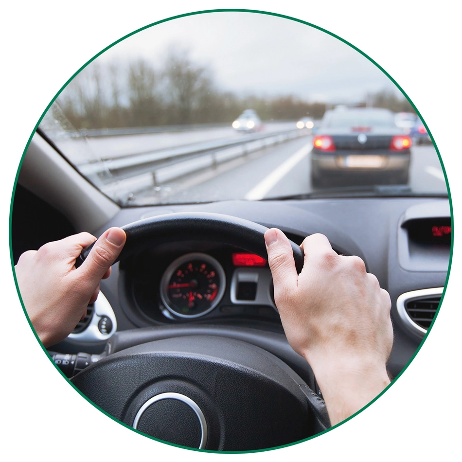 car-driving-near-collision-circle-crop-LG Hands on a steering wheel