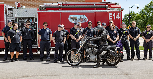 Fire Department visiting with a motorcyclist