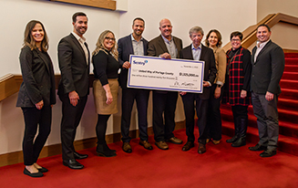 Group of Sentry leaders presenting donation check to the Portage County United Way