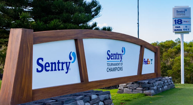 Sign with three logos: Sentry, Sentry Tournament of Champions, and Fedex