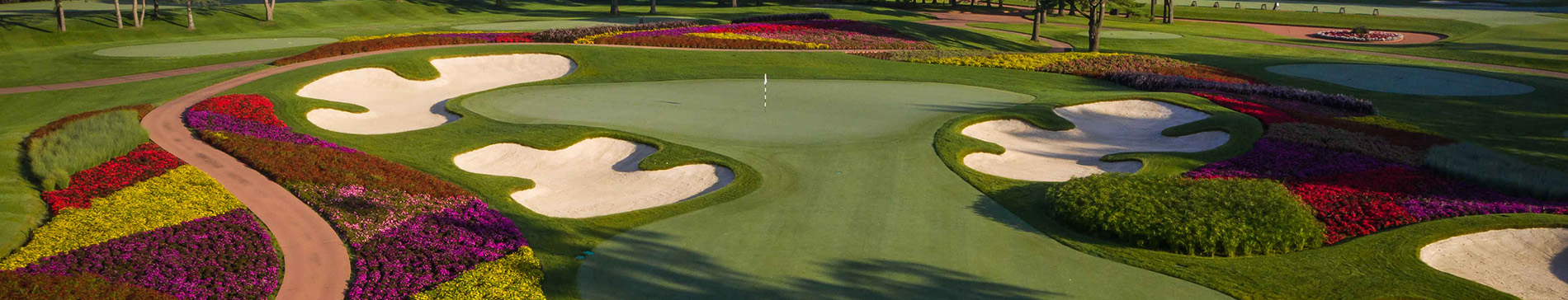 Artfully planted flowers surrounding the 16th hole at SentryWorld. 