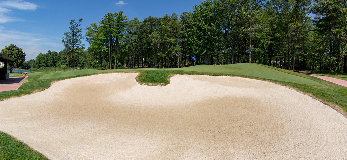 Greenside bunker next to the practice putting green at SentryWorld