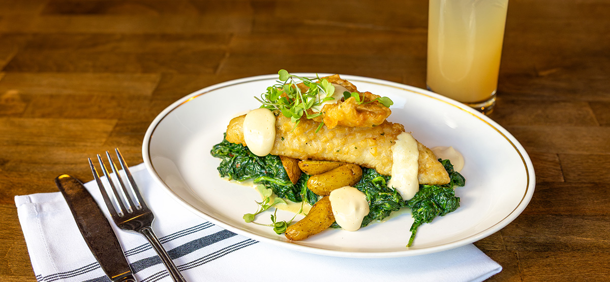 Battered walleye, crispy fingerlings, creamed spinach, and malt vinegar aioli.