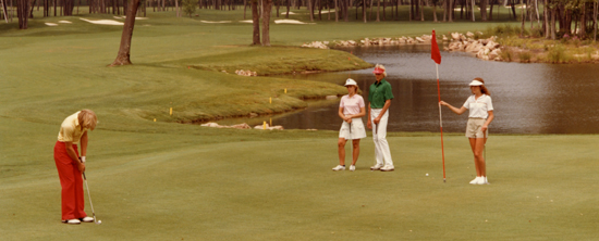 Golfers putting on a SentryWorld putting green