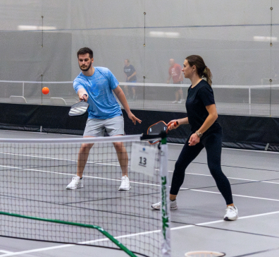 One male and one woman pickleball players at SentryWorld.