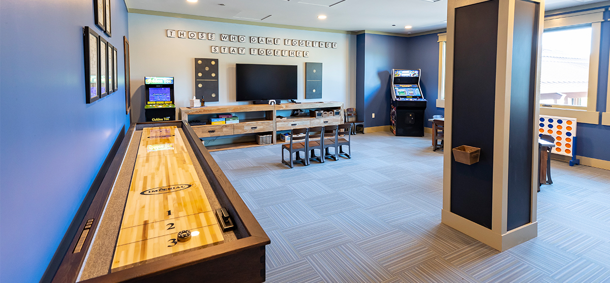 carousel-amenities-kids-club-1-1200x556 The Inn kids club indoor shuffleboard and tv area.