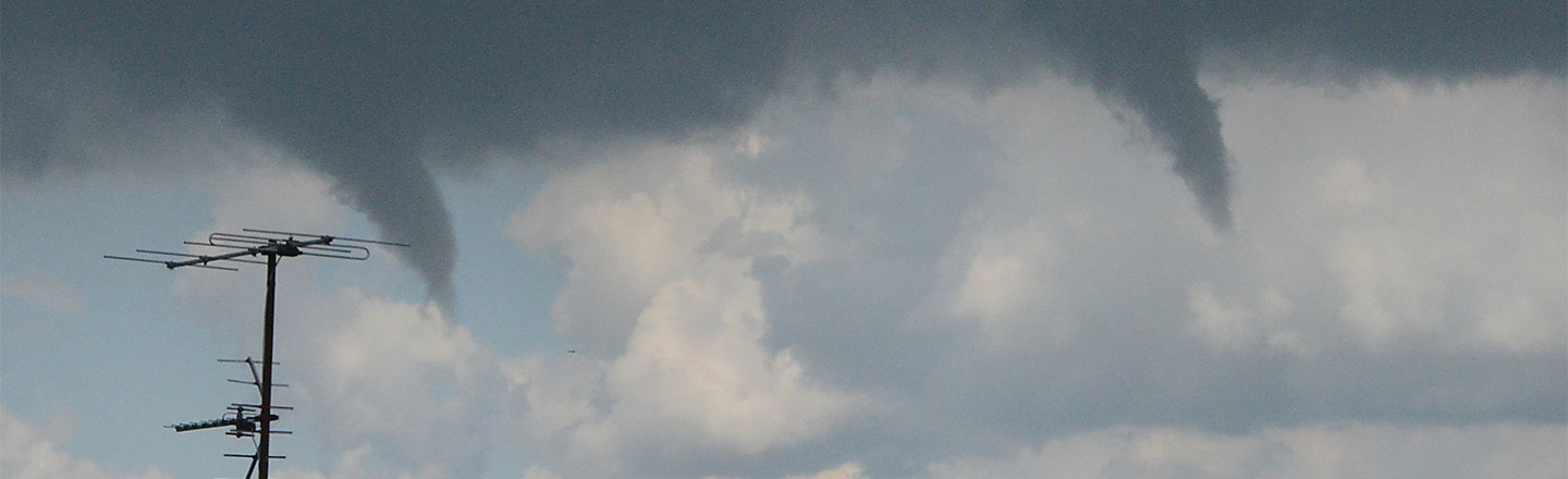 Tornadoes forming in sky