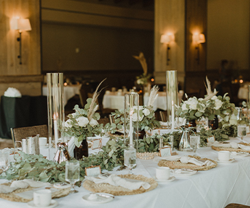 Greenery and table decor for a wedding reception in the Grand Hall