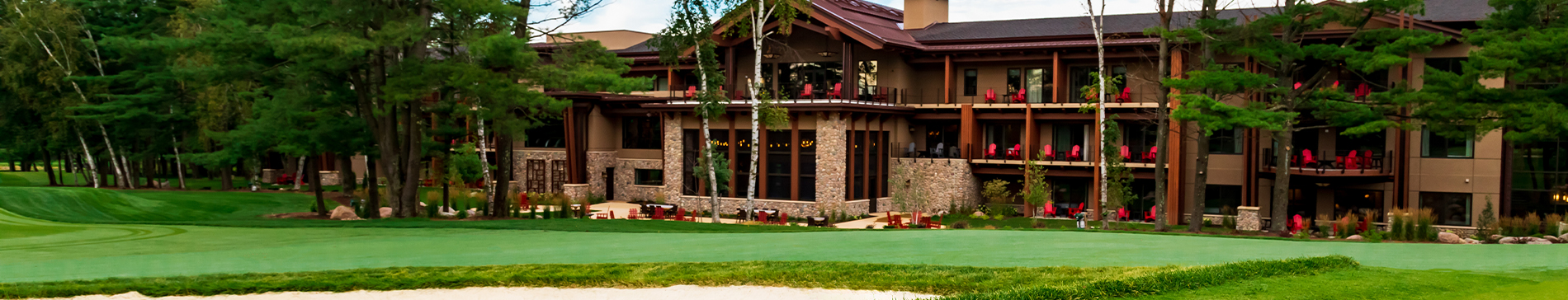 View of The Inn at SentryWorld and a sand trap from the golf course