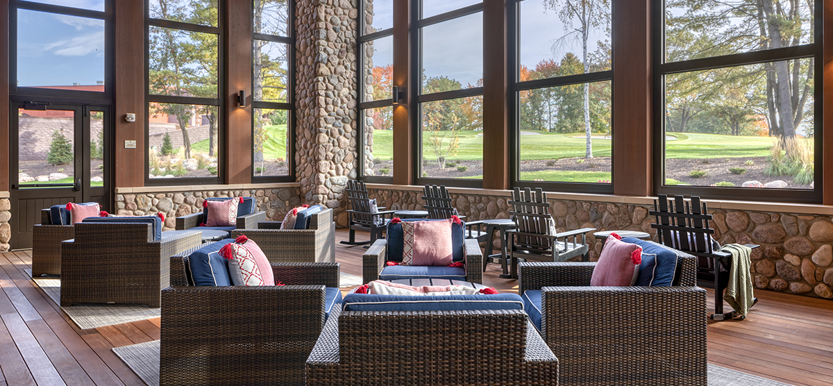 The Inn back porch seating area overlooking hole 18.