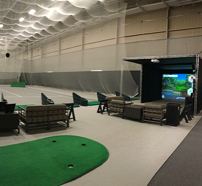 Fieldhouse indoor driving range and simulator area. 