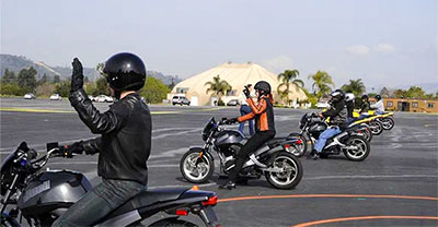 People learning to ride motorcycles