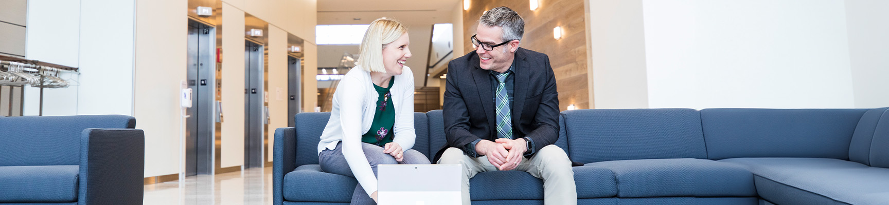 Two associates collaborating in the lobby at the Division Street office in Stevens Point, Wisconsin.