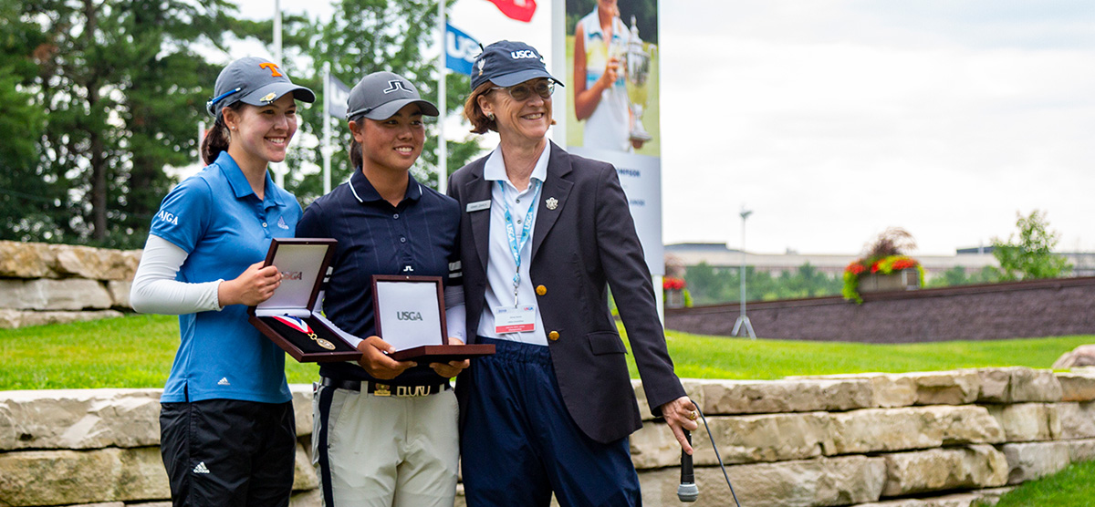 Nicole Whiston and Yuka Saso posing with medals at the USGA championship at SentryWorld