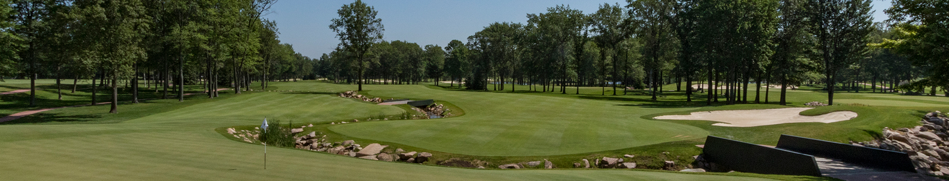 Stream and sand trap along a SentryWorld fairway